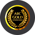 A circular black and gold badge displays the text ABC GOLD STANDARD surrounded by two golden laurel branches.