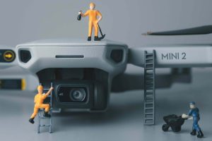 Plastic figurines climbing a drone